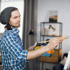 man drawing with brush on canvas at art studio 2022 04 27 03 30 46 utc min scaled